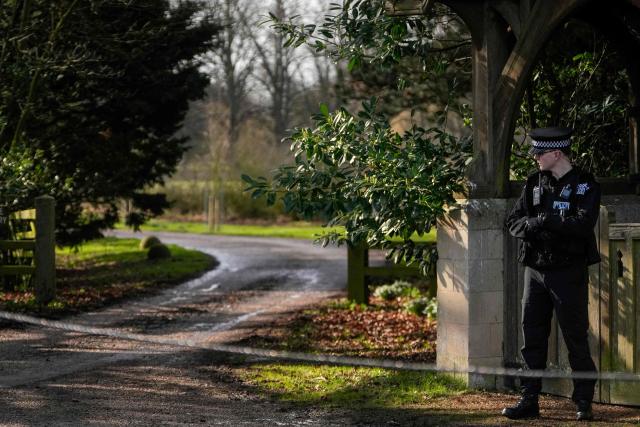 A policeman stands guard at an entrance to Wood Farm on the royal family's Sandringham Estate in Norfolk, eastern England on February 22, 2026, after Britain's former prince Andrew was arrested on February 19. (Photo by CARLOS JASSO / AFP)