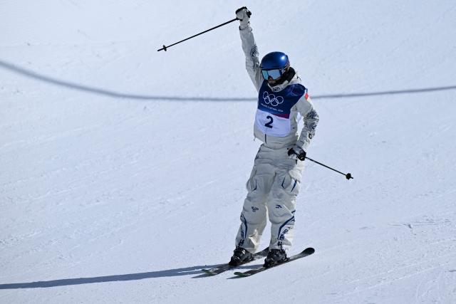 China's Gu Ailing Eileen reacts in the freestyle skiing women's freeski halfpipe final run 3 during the Milano Cortina 2026 Winter Olympic Games at Livigno Snow Park, in Livigno (Valtellina), on February 22, 2026. (Photo by Kirill KUDRYAVTSEV / AFP)