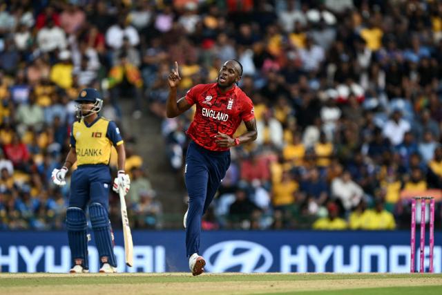 England's Jofra Archer (C) celebrates after taking the wicket of Sri Lanka's Kamil Mishara during the 2026 ICC Men's T20 Cricket World Cup Super Eights match between Sri Lanka and England at Pallekele International Cricket Stadium in Kandy on February 22, 2026. (Photo by Ishara S. KODIKARA / AFP)