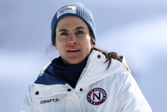 Silver medallist Norway's Heidi Weng celebrates on the podium the women's cross country 50km mass start final event of the Milano Cortina 2026 Winter Olympic Games at Tesero Cross-Country Skiing Stadium in Lago di Tesero (Val di Fiemme), on February 22, 2026. (Photo by Anne-Christine POUJOULAT / AFP)