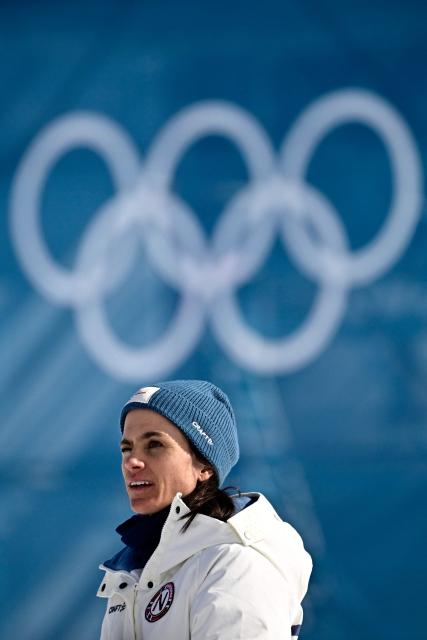 Silver medallist Norway's Heidi Weng celebrates on the podium the women's cross country 50km mass start final event of the Milano Cortina 2026 Winter Olympic Games at Tesero Cross-Country Skiing Stadium in Lago di Tesero (Val di Fiemme), on February 22, 2026. (Photo by Tobias SCHWARZ / AFP)