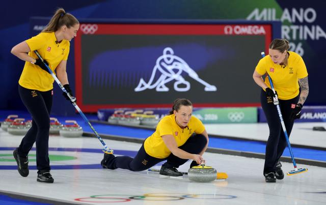 Sweden's Agnes Knochenhauer delivers the stone in the curling women's round robin gold medal game between Switzerland and Sweden during the Milano Cortina 2026 Winter Olympic Games at the Cortina Curling Olympic Stadium in Cortina d’Ampezzo on February 22, 2026. (Photo by Odd ANDERSEN / AFP)