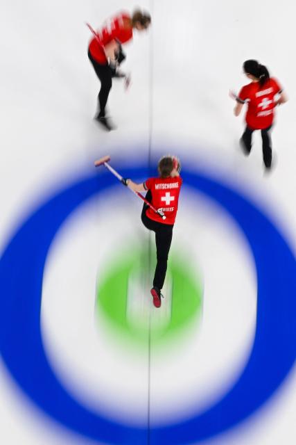Switzerland's Selina Witschonke delivers the stone in the curling women's round robin gold medal game between Switzerland and Sweden during the Milano Cortina 2026 Winter Olympic Games at the Cortina Curling Olympic Stadium in Cortina d’Ampezzo on February 22, 2026. (Photo by Franзois-Xavier MARIT / AFP)