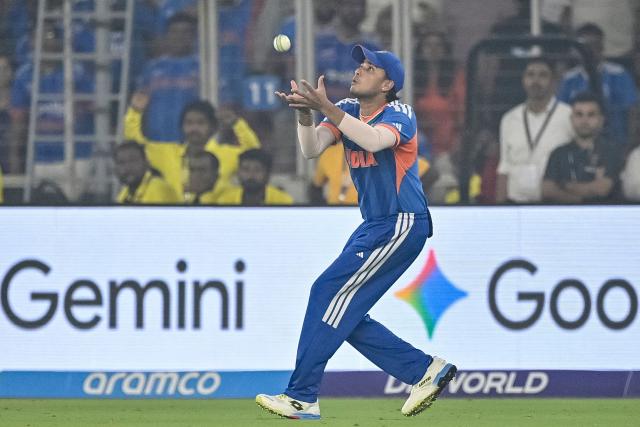 India's Abhishek Sharma takes a catch to dismiss South Africa's Dewald Brevis during the 2026 ICC Men's T20 Cricket World Cup Super Eights match between India and South Africa at the Narendra Modi Stadium in Ahmedabad on February 22, 2026. (Photo by Shammi MEHRA / AFP)