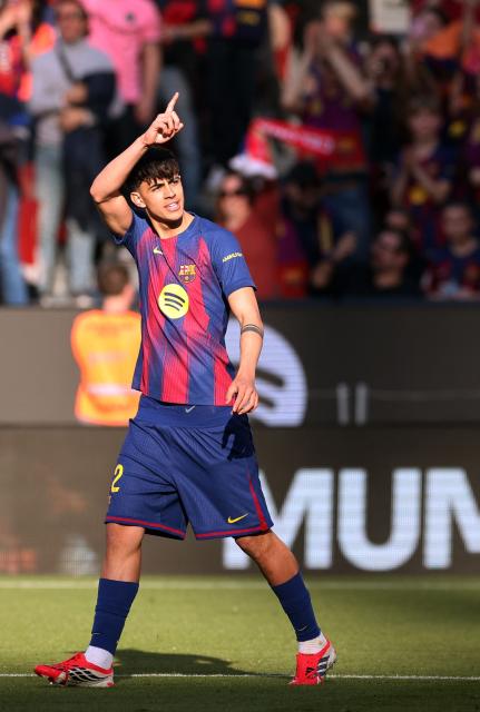 Barcelona's Spanish midfielder #22 Marc Bernal celebrates scoring the opening goal during the Spanish league football match between FC Barcelona and Levante UD at Camp Nou Stadium in Barcelona on February 22, 2026. (Photo by Josep LAGO / AFP)
