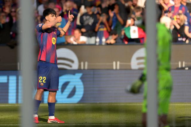 Barcelona's Spanish midfielder #22 Marc Bernal celebrates scoring the opening goal during the Spanish league football match between FC Barcelona and Levante UD at Camp Nou Stadium in Barcelona on February 22, 2026. (Photo by Josep LAGO / AFP)