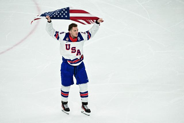 USA's #19 Matthew Tkachuk celebrates after winning the men's gold medal ice hockey match between Canada and USA at the Milano Santagiulia Ice Hockey Arena during the Milano Cortina 2026 Winter Olympic Games in Milan, on February 22, 2026. (Photo by JULIEN DE ROSA / AFP)