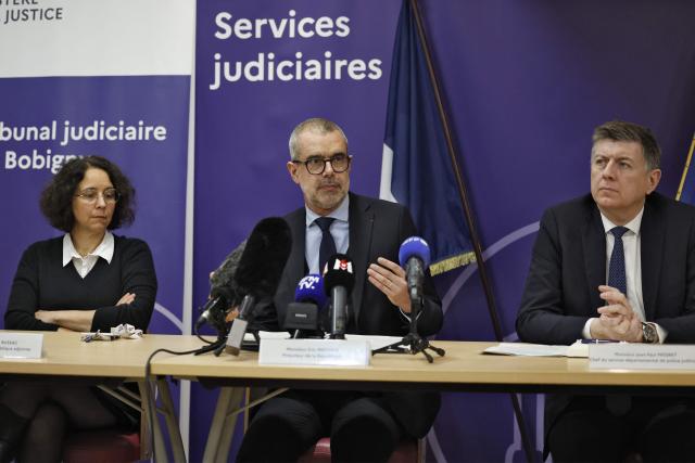 Public Prosecutor at the Judicial Court of Bobigny Eric Mathais (C) speaks next to his deputy Fanny Bussac (L) and head of the departmental judicial police service (R) Jean-Paul Mégret during a press conference following the simultaneous abduction in Seine-Saint-Denis of three children, including one who has already been found, in Bobigny, on the outskirts of Paris on February 22, 2026. The six-week-old infant abducted on February 19 by his parents was found alive on February 21 afternoon, after being taken to a hospital in Lille, but the search continues to find his brother Nael, 18 month-old, and sister Eline, 2,5 year-old. The parents Abdelkader Benabderrahmane, 24, and Chaima Hat-Tab, 20, are suspected of the simultaneous abduction in Seine-Saint-Denis of their three children who had been placed in the care of the child welfare services (ASE). (Photo by Charlotte SIEMON / AFP)