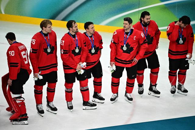 Silver medallists Canada's players react after the  men's gold medal ice hockey match between Canada and USA at the Milano Santagiulia Ice Hockey Arena during the Milano Cortina 2026 Winter Olympic Games in Milan, on February 22, 2026. (Photo by JULIEN DE ROSA / AFP)
