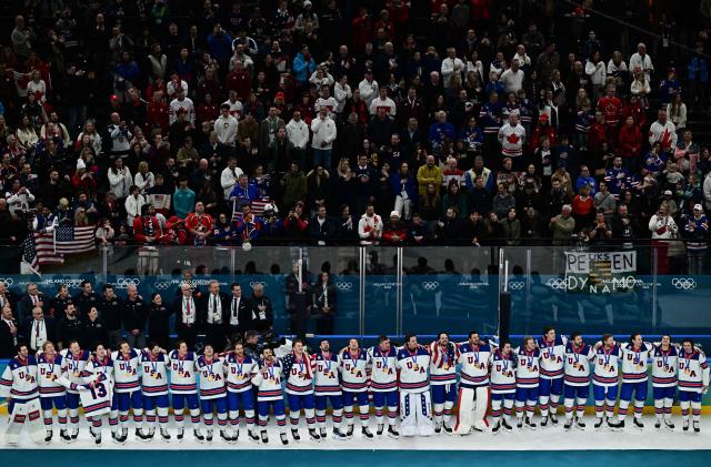 Gold medallists USA's players pose during the medals ceremony of the men's ice hockey event at the Milano Santagiulia Ice Hockey Arena during the Milano Cortina 2026 Winter Olympic Games in Milan, on February 22, 2026. (Photo by JULIEN DE ROSA / AFP)