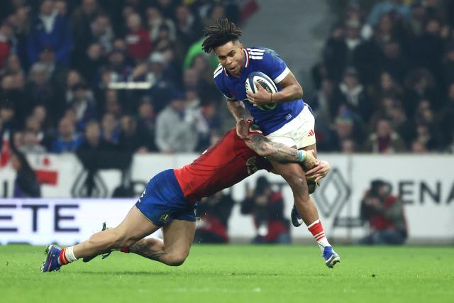 France's wing Théo Attissogbe attempts to break away during the Six Nations international rugby union match between France and Italy at the Stade Pierre-Mauroy in Villeneuve-d'Ascq, northern France, on February 22, 2026. (Photo by Sameer AL-DOUMY / AFP)