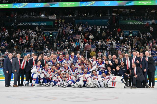 Gold medalists USA's players celebrate with their medals after the medals ceremony of the men's ice hockey event at the Milano Santagiulia Ice Hockey Arena during the Milano Cortina 2026 Winter Olympic Games in Milan, on February 22, 2026. (Photo by Alexander NEMENOV / AFP)