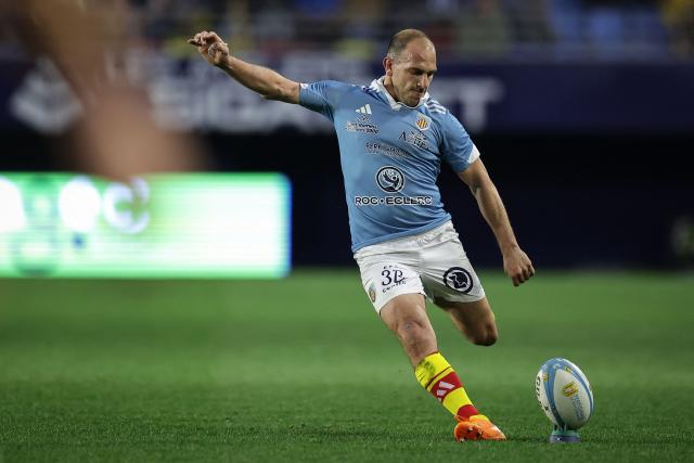 Perpignan's Argentinian fly-half Benjamin Urdapilleta kicks a conversion during the French Top 14 rugby union match between USA Perpignan and Section Paloise Bearn Pyrenees (Pau) at the Aime-Giral stadium in Perpignan, south-western France on February 22, 2026. (Photo by Valentine CHAPUIS / AFP)