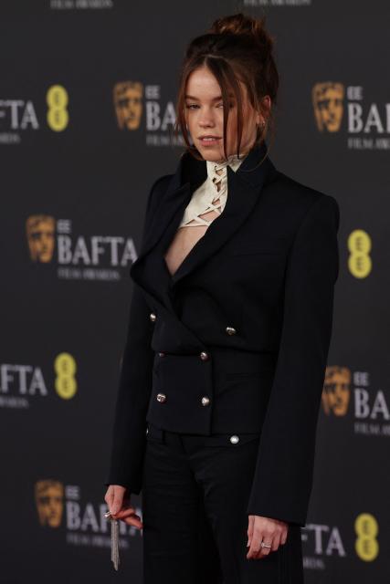 Australian actress Milly Alcock poses on the red carpet upon arrival at the BAFTA British Academy Film Awards at the Royal Festival Hall, Southbank Centre, in London, on February 22, 2026. (Photo by Adrian Dennis / AFP)