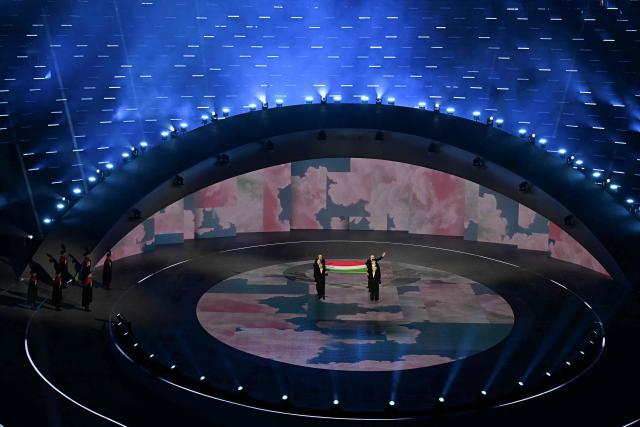 The Italian flag is presented during the closing ceremony of the Milano Cortina 2026 Winter Olympic Games at the Verona Arena in Verona, northern Italy, on February 22, 2026. (Photo by Gabriel BOUYS / AFP)