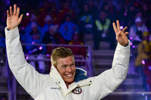 Silver medallist Norway's Martin Loewstroem Nyenget celebrates on the podium for the men's cross country 50km mass start final event of the Milano Cortina 2026 Winter Olympic Games, within the games' closing ceremony at the Verona Arena in Verona on February 22, 2026. (Photo by Stefano RELLANDINI / AFP)