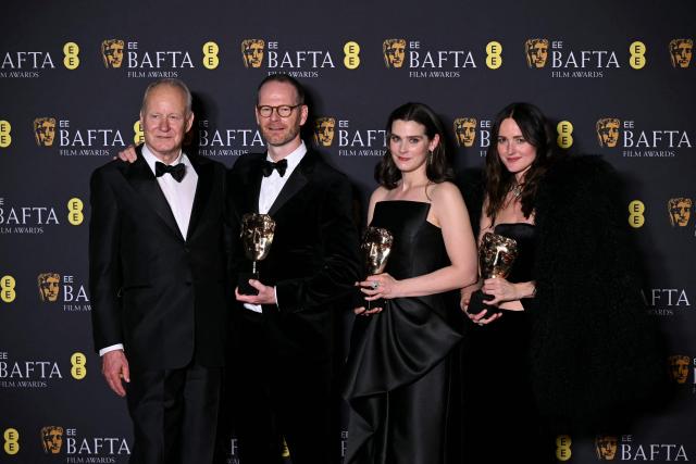 Swedish actor Stellan skarsgard, Danish-Norwegian film director Joachim Trier, Norwegian film producer Maria Ekerhovd and Norwegian film producer Andrea Berentsen Ottmar pose with the award for Best film not in English language for "Sentimental Value" during the BAFTA British Academy Film Awards ceremony at the Royal Festival Hall, Southbank Centre, in London, on February 22, 2026. (Photo by JUSTIN TALLIS / AFP)