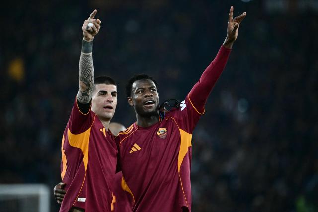 Roma's Ivorian defender #05 Obite Evan Ndicka (R) celebrates scoring his team's second goal during the Italian Serie A football match between AS Roma and Cremonese at the Olympic Stadium in Rome on Febuary 22, 2026. (Photo by Filippo MONTEFORTE / AFP)