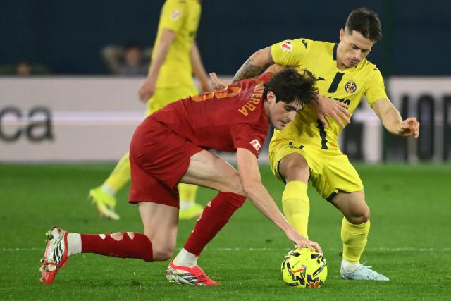 Valencia's Spanish midfielder # 11 Luis Rioja and Villarreal's Moroccan forward #11 Ilias Akhomach fight for the ball during the Spanish league football match between Villarreal CF and Valencia CF at La Ceramica Stadium in Vila-real on February 22, 2026. (Photo by JOSE JORDAN / AFP)