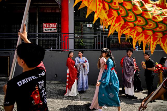 Members of the Chinese community in Panama take part in a parade to celebrate the Chinese New Year, marking the beginning of the Year of the Fire Horse, in Panama City on February 22, 2026. (Photo by Martin BERNETTI / AFP)