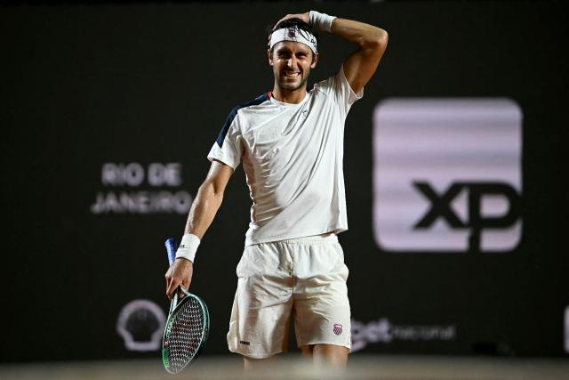 Argentina's Tomas Etcheverry reacts after missing a point against Chile's Alejandro Tabilo  during their men's singles final match at the Rio Open tennis tournament in Rio de Janeiro, Brazil, on February 22, 2026. (Photo by Mauro PIMENTEL / AFP)