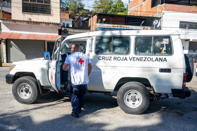 A vehicle of the Venezuelan Red Cross leaves El Rodeo I prison in Guatire, Miranda state, Venezuela on February 22, 2026. More than 200 Venezuelan political prisoners were on hunger strike on February 22 to demand their release under a new amnesty law that excludes many of them. The amnesty was approved by Venezuela's congress on February 19, 2026, as part of a wave of reforms encouraged by the United States after it ousted and captured former president Nicolas Maduro on January 3. (Photo by Maryorin Mendez / AFP)