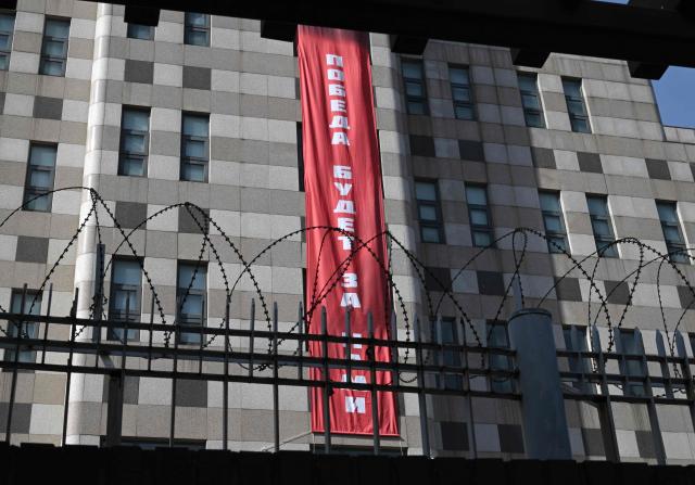 A banner reading "Victory will be ours" is displayed on the exterior wall of the Russian embassy in Seoul on February 23, 2026. South Korea has protested to Russia after its embassy in Seoul unfurled a giant banner declaring "Victory will be ours", an apparent reference to the anniversary of the Ukraine war. (Photo by Jung Yeon-je / AFP)