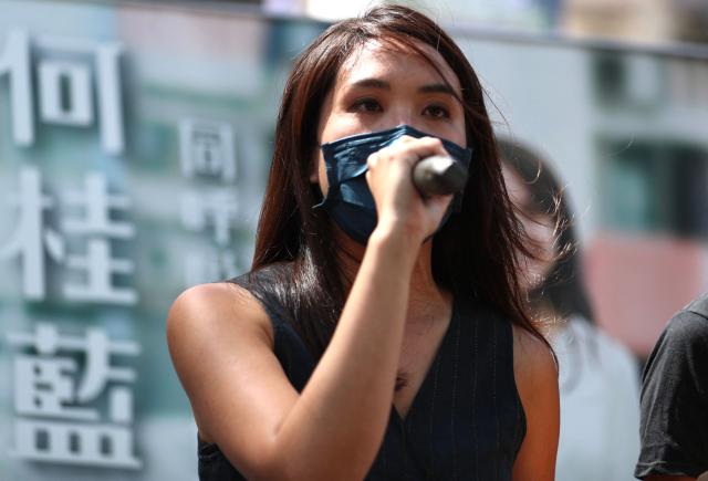(FILES) Gwyneth Ho, a candidate of New Territory East, campaigns during a primary election in Hong Kong on July 11, 2020. Hong Kong's Court of Appeal upheld the jailing of 12 democracy campaigners on February 23, 2026 as part of a high-profile subversion case under a Beijing-imposed national security law. (Photo by May JAMES / AFP)
