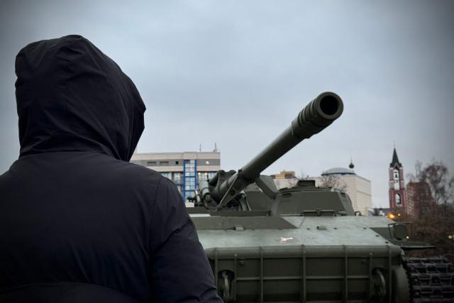 The 48-year-old Ukrainian living in Russia for 20 years, Maria (whose name has been changed to protect her identity) visits a temporary open-air exhibition of military hardware in the Moscow region on December 17, 2025. (Photo by AFP)