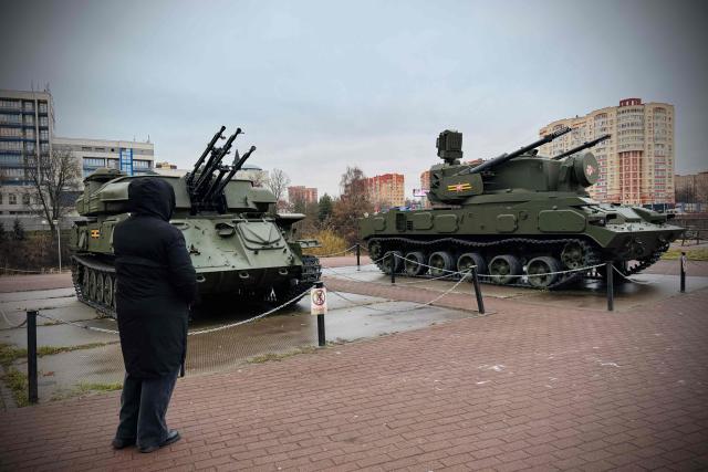 The 48-year-old Ukrainian living in Russia for 20 years, Maria (whose name has been changed to protect her identity) visits a temporary open-air exhibition of military hardware in the Moscow region on December 17, 2025. (Photo by AFP)