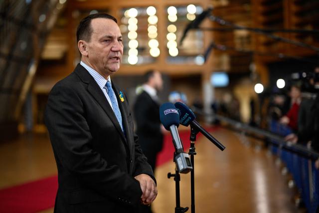 Poland's Foreign Minister Radoslaw Sikorski speaks to the press as he arrives for the EU Foreign Affairs Council in Brussels on February 23, 2026. (Photo by JOHN THYS / AFP)