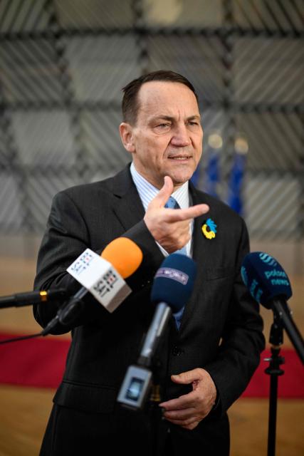 Poland's Foreign Minister Radoslaw Sikorski speaks to the press as he arrives for the EU Foreign Affairs Council in Brussels on February 23, 2026. (Photo by JOHN THYS / AFP)