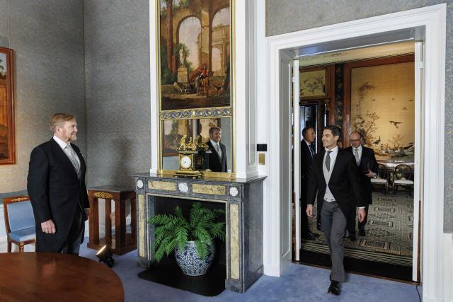 Netherlands' King Willem-Alexander (L) welcomes Prime Minister Rob Jetten (R) before taking part in the signing of the Royal Decrees in the Meeting Room at Huis ten Bosch Palace as part of the swearing-in ceremony of the new cabinet in The Hague, The Netherlands on February 23, 2026. The new Dutch government will be sworn in today, with 38-year-old centrist Rob Jetten set to be the country's youngest-ever prime minister. (Photo by Koen van Weel / ANP / AFP) / Netherlands OUT