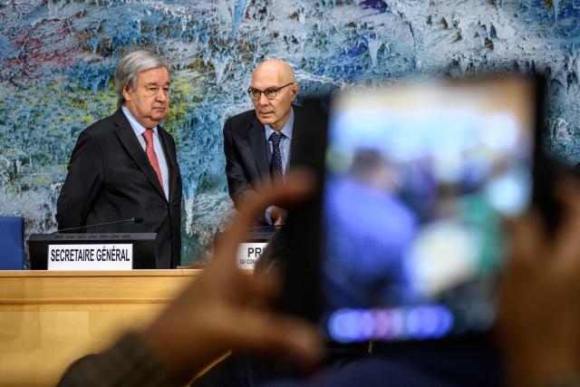 UN Secretary-General Antonio Guterres (L) and UN High Commissioner for Human Rights Volker Turk stand at the opening of the 61st session of the UN Human Rights Council at the United Nations office in Geneva on February 23, 2026. Human rights are under "full-scale attack around the world", United Nations chief Antonio Guterres warned on February 23, 2026, with the most powerful often leading the charge. (Photo by Fabrice COFFRINI / AFP)