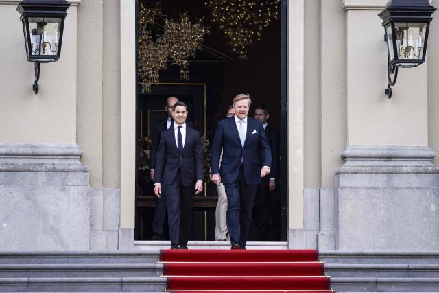 Netherlands' new Prime minister Rob Jetten and Netherlands' Willem-Alexander appear on the top of the steps ahead of the family photograph as part of the swearing-in ceremony of the new Jetten cabinet at Huis ten Bosch Palace in The Hague, The Netherlands on February 23, 2026. The new Dutch government will be sworn in today, with 38-year-old centrist Rob Jetten set to be the country's youngest-ever prime minister. (Photo by Jeroen Jumelet / ANP / AFP) / Netherlands OUT