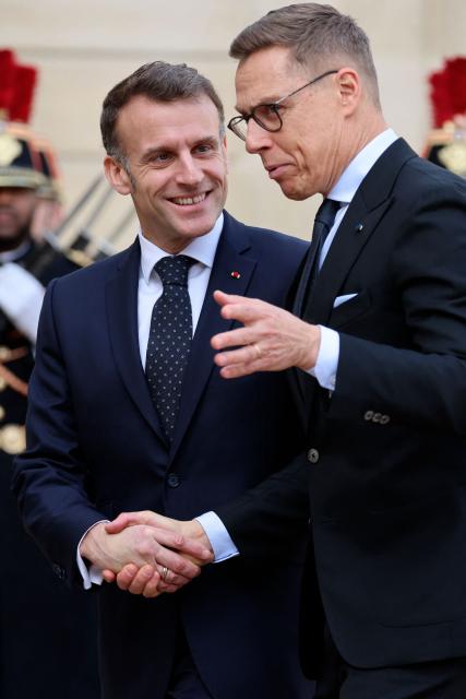 France's President Emmanuel Macron welcomes Finland's President Alexander Stubb before a meeting at The Elysee Presidential Palace in Paris on February 23, 2026. (Photo by Ludovic MARIN / AFP)