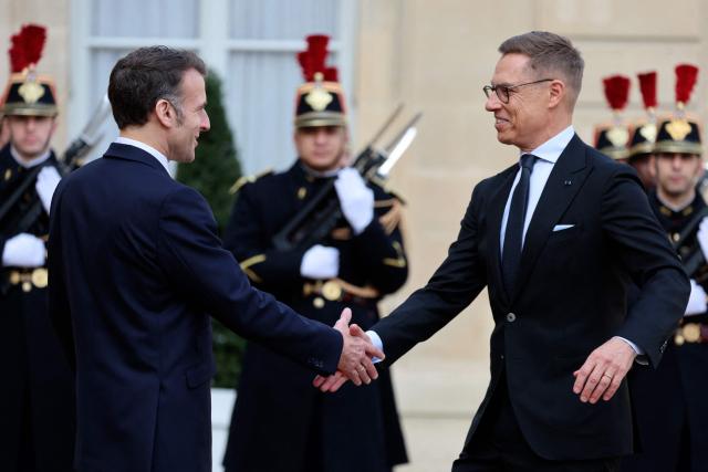 France's President Emmanuel Macron welcomes Finland's President Alexander Stubb before a meeting at The Elysee Presidential Palace in Paris on February 23, 2026. (Photo by Ludovic MARIN / AFP)