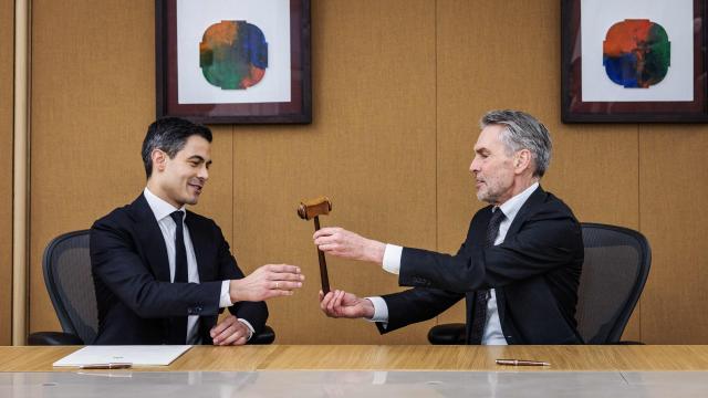 The Netherlands former Prime Minister Dick Schoof (R) and his successor Rob Jetten (L) attend the traditional handover ceremony in the Treveszaal room in The Hague on February 23, 2026. (Photo by Remko de Waal / ANP / AFP) / Netherlands OUT