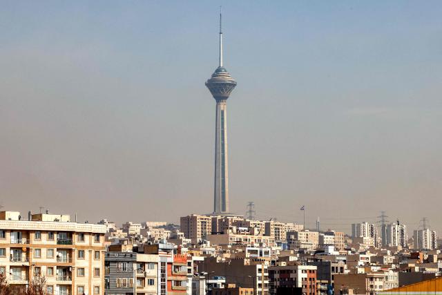 Milad (Birth) Tower, the tallest tower in Iran at 435 metres, is pictured in the Tehran skyline on February 23, 2026. Completed in October 2008 after an 11-year-long construction period, Milad Tower was intended by the new Islamic Republic government that replaced the Shah to create a new symbol for Tehran to replace the Azadi Tower, a symbol of the former Pahlavi era. (Photo by ATTA KENARE / AFP)