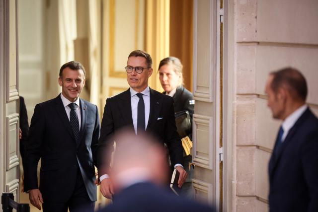 France's President Emmanuel Macron and Finland's President Alexander Stubb (R) arrive to deliver a joint statement at The Elysee Presidential Palace in Paris on February 23, 2026. (Photo by Thomas Padilla / POOL / AFP)