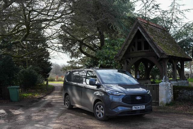A vehicle leaves from an entrance to Wood Farm on the royal family's Sandringham Estate in Norfolk, eastern England on February 22, 2026, after Britain's former prince Andrew was arrested on February 19. (Photo by CARLOS JASSO / AFP)