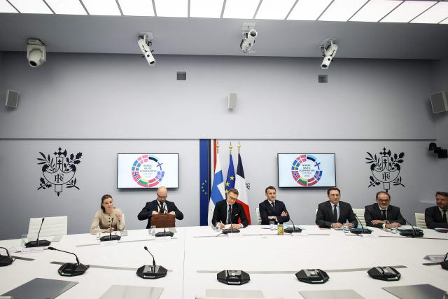 France's President Emmanuel Macron (C-R) and Finland's President Alexander Stubb (C-L) attend a Nordic-Baltic Eight (NB8) video conference at The Elysee Presidential Palace in Paris on February 23, 2026. (Photo by Thomas Padilla / POOL / AFP)