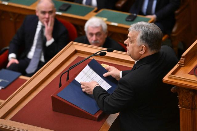 Hungarian Prime Minister Viktor Orban (R) addresses a speech before the agenda in the main hall of the parliament building during the spring session of the Hungarian Parliament in Budapest, Hungary, on February 23, 2026. The nationalist leader is facing the toughest challenge since returning to power in 2010, with his Fidesz party trailing the opposition TISZA party in opinion polls ahead of parliamentary elections on April 12, 2026. (Photo by Attila KISBENEDEK / AFP)