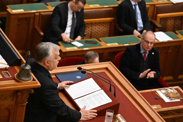Hungarian Prime Minister Viktor Orban (L) addresses a speech before the agenda in the main hall of the parliament building during the spring session of the Hungarian Parliament in Budapest, Hungary, on February 23, 2026. The nationalist leader is facing the toughest challenge since returning to power in 2010, with his Fidesz party trailing the opposition TISZA party in opinion polls ahead of parliamentary elections on April 12, 2026. (Photo by Attila KISBENEDEK / AFP)