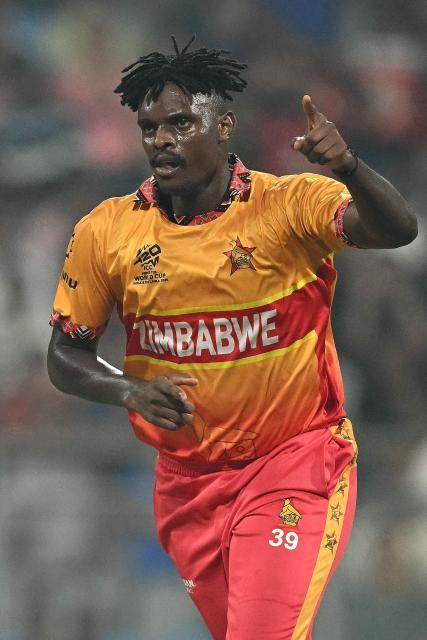 Zimbabwe's Richard Ngarava celebrates after taking the wicket of West Indies Brendon King during the 2026 ICC Men's T20 Cricket World Cup Super Eights match between West Indies and Zimbabwe at the Wankhede Stadium in Mumbai on February 23, 2026. (Photo by Punit PARANJPE / AFP)