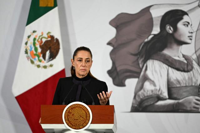 Mexico's President Claudia Sheinbaum speaks during her daily press conference at Palacio Nacional in Mexico City on February 23, 2026. Mexico was on high alert on February 23 with schools closed and travelers stranded, as members of a powerful drug cartel went on a violent rampage across parts of the country after the army announced it had killed its leader. (Photo by YURI CORTEZ / AFP)