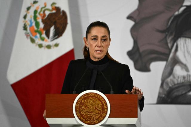 Mexico's President Claudia Sheinbaum speaks during her daily press conference at Palacio Nacional in Mexico City on February 23, 2026. Mexico was on high alert on February 23 with schools closed and travelers stranded, as members of a powerful drug cartel went on a violent rampage across parts of the country after the army announced it had killed its leader. (Photo by YURI CORTEZ / AFP)