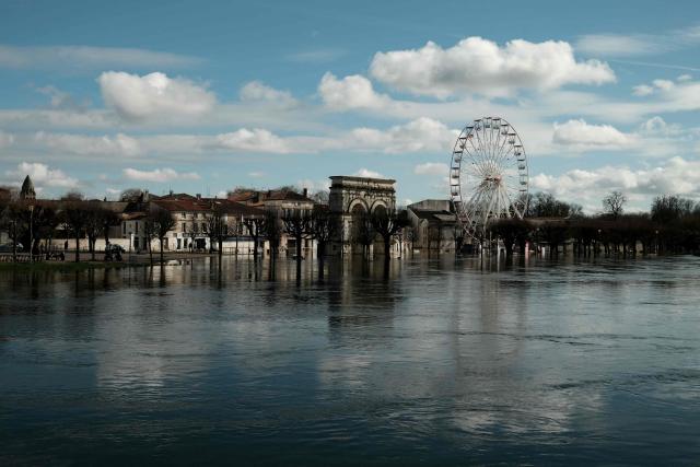 Water floods the banks of the Charente River following severe flooding caused by Storm Nils in Saintes, south-western France, on February 23, 2026. (Photo by Philippe LOPEZ / AFP)