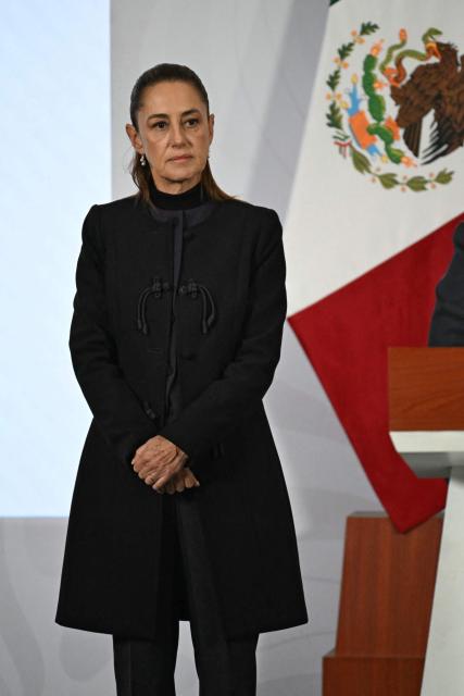 Mexico's President Claudia Sheinbaum is seen during her daily press conference at Palacio Nacional in Mexico City on February 23, 2026. Mexico was on high alert on February 23 with schools closed and travelers stranded, as members of a powerful drug cartel went on a violent rampage across parts of the country after the army announced it had killed its leader. (Photo by YURI CORTEZ / AFP)