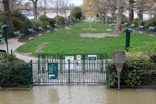 This photograph shows the flooded Square du Vert Galant in Paris on February 23, 2026. (Photo by Ludovic MARIN / AFP)
